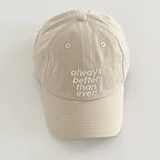 Beige cap with 'always better than ever' text on a light gray background