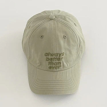 Khaki cap with 'always better than ever' text on a white background