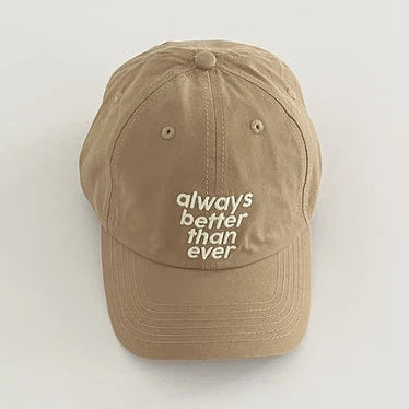 Beige cap with 'always better than ever' text on a white background