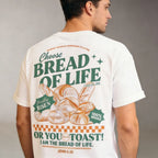 Man wearing a white t-shirt with a Bread of Life -themed design and text.
