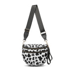 Cow print Baye Bag with a strap on a white background