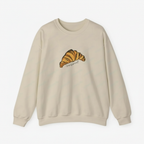 Cream sweatshirt with a croissant graphic on a white background