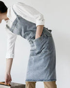 Person wearing a Draper Denim Apron over a white shirt on a plain background