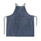 Blue denim apron on a white background