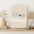 Framed artwork of coffee-themed figures on a shelf with decorative items.
