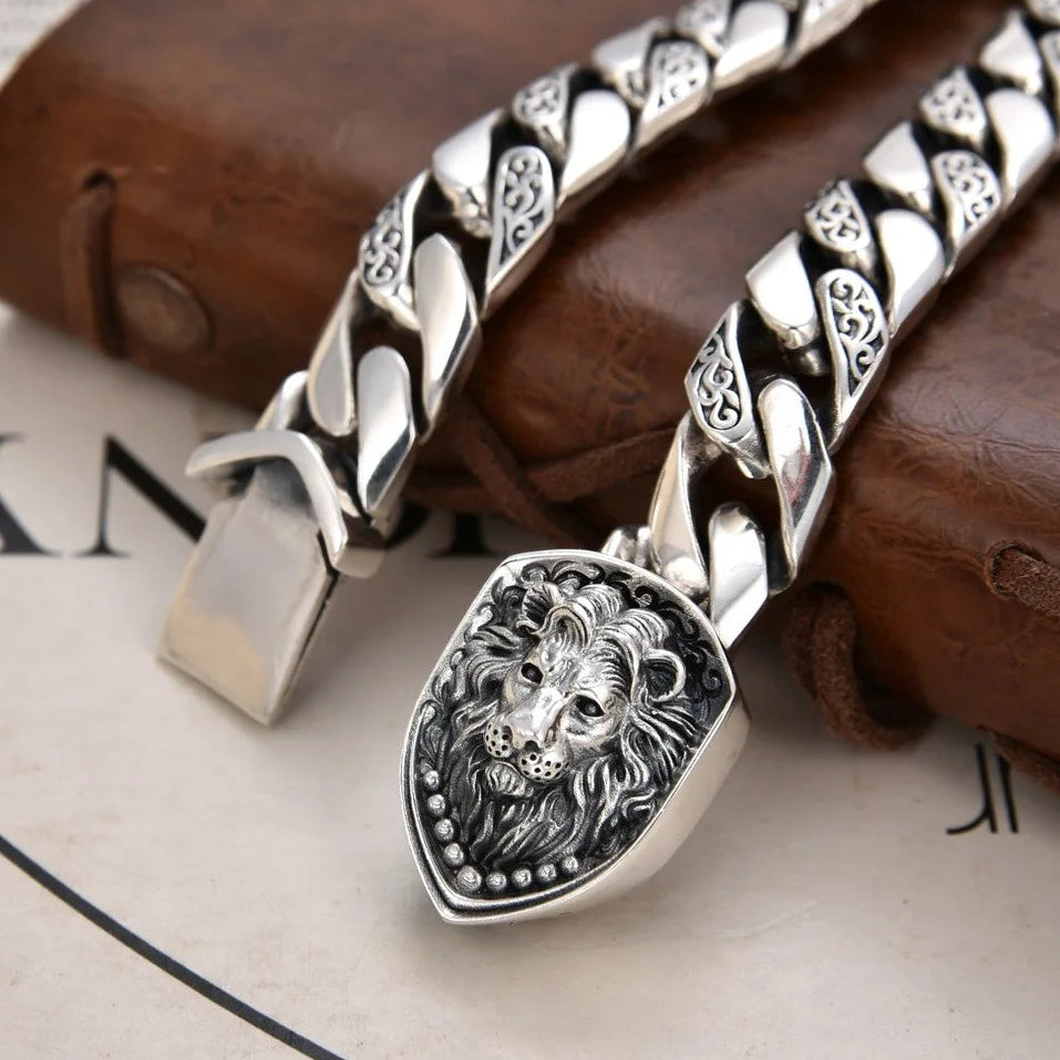 Silver bracelet with lion emblem.