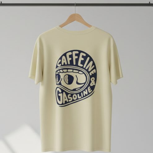 Beige t-shirt with graphic design on a hanger against a gray background