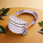 LilacWhite checkered Baye Bag on a beige background with green leaves