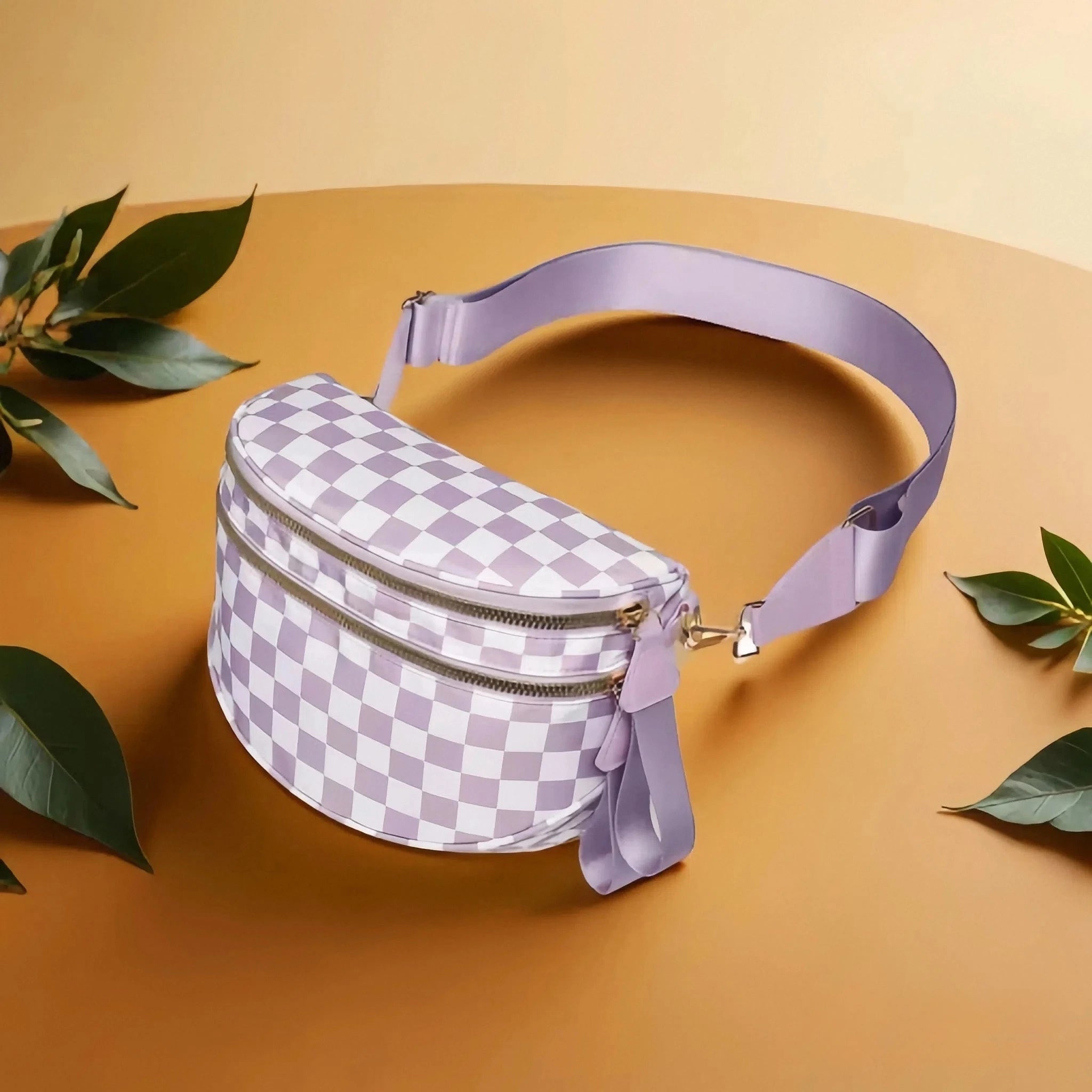 LilacWhite checkered Baye Bag on a beige background with green leaves