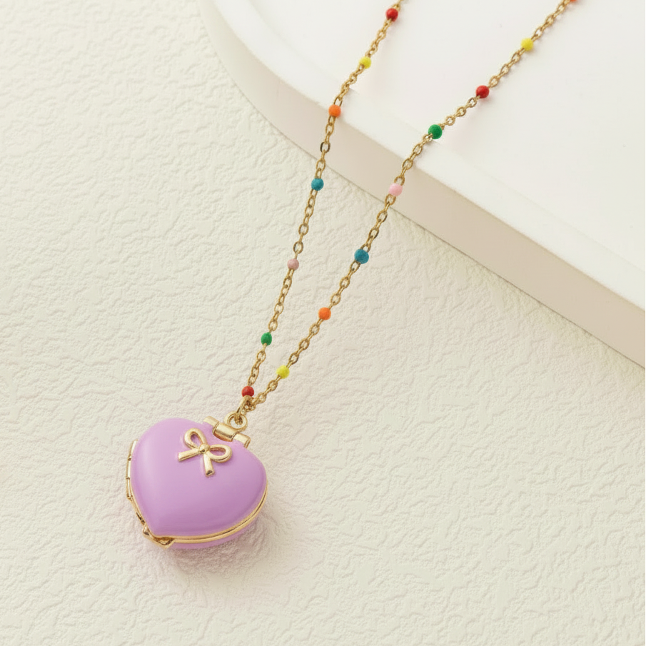Necklace with a purple heart-shaped pendant on a neutral background