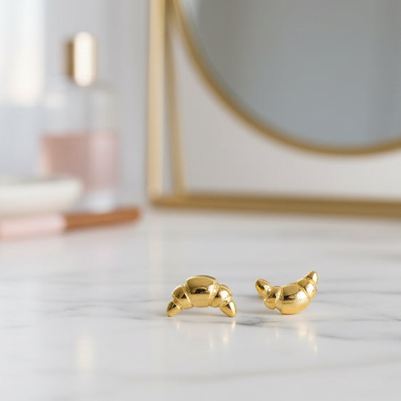 Gold croissant-shaped earrings.