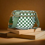 Green and white checkered Baye bag with green strap on a brown surface