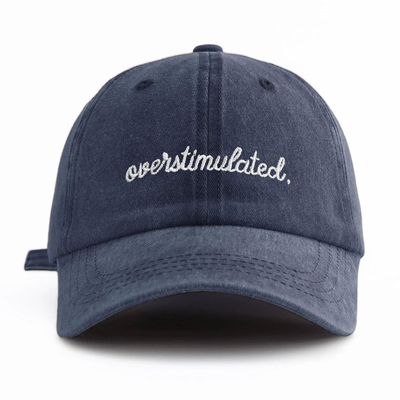 Navy blue cap with 'overstimulated' text on a white background
