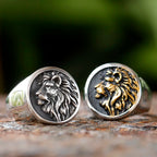 Two, Lion of Judah Signet Rings. One silver and one with gold detailing.