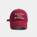Red cap with 'Break Free From The Routine' text on a white background.