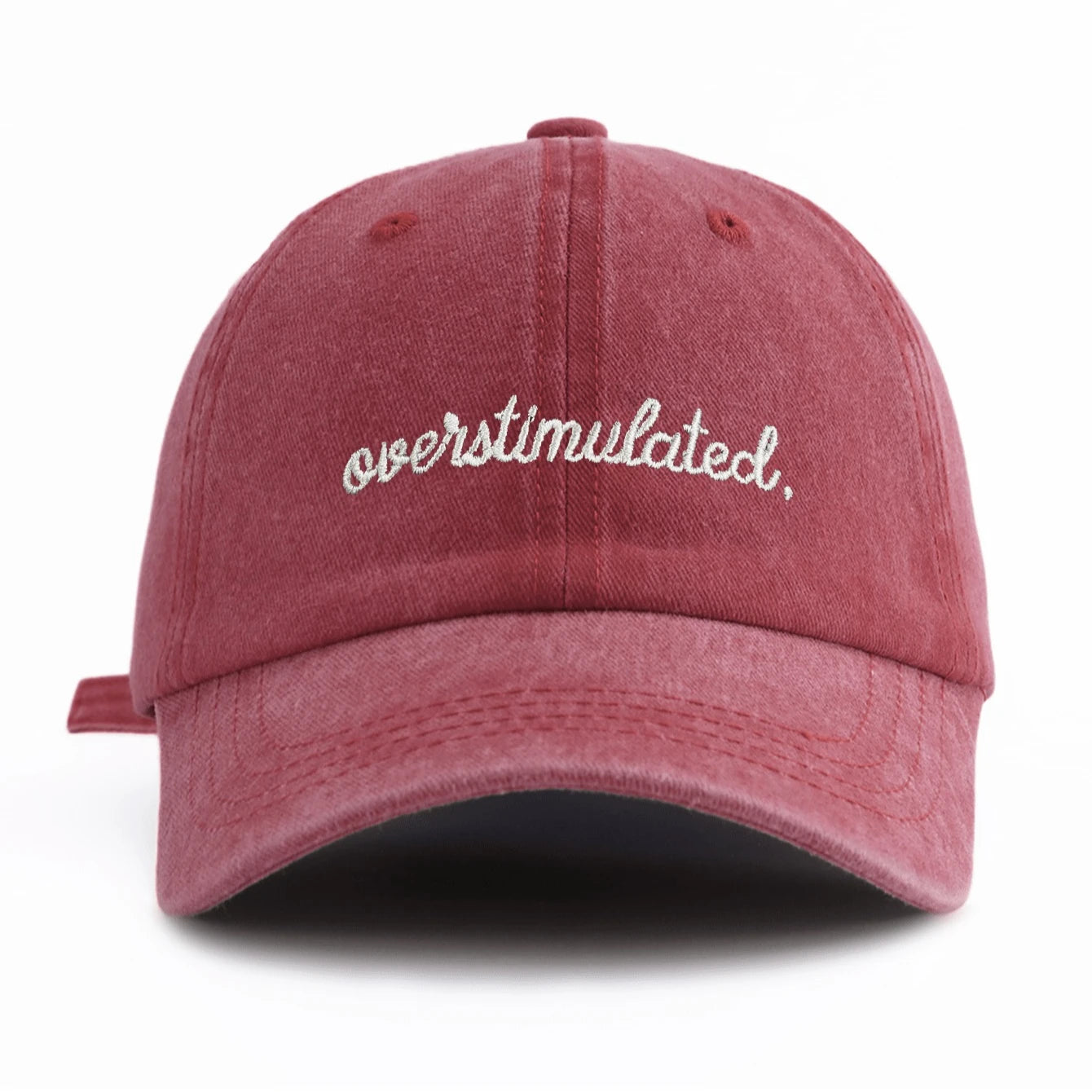 Red cap with 'overstimulated' text on a white background