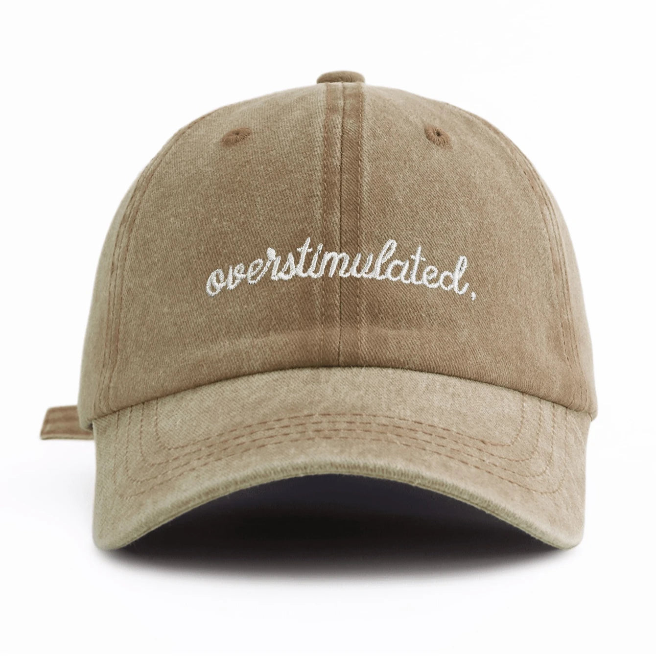 Beige cap with 'overstimulated' text on a white background