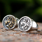 Two Lion of Judah Signet Rings with silver and gold detailing.