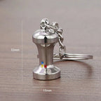 Metal keychain with measurements on a wooden surface