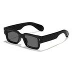 Black sunglasses with dark lenses on a white background