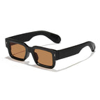 Black sunglasses with brown lenses on a white background