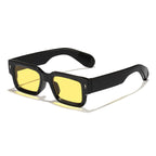 Black sunglasses with yellow lenses on a white background