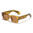 Sunglasses with leopard print frame and brown lenses on a white background
