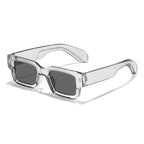 Clear frame sunglasses with dark lenses on a white background