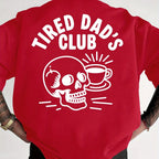 Red t-shirt with 'Tired Dad's Club' design featuring a skull and coffee cup on a white background