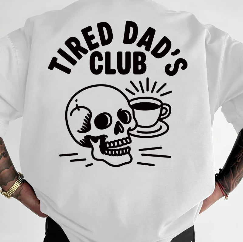 White t-shirt with 'Tired Dad's Club' graphic and skull design on a plain background
